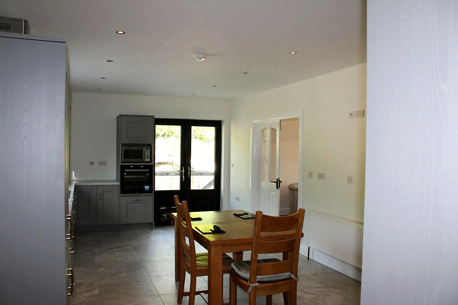 New-build dining and kitchen space painted throughout before handover