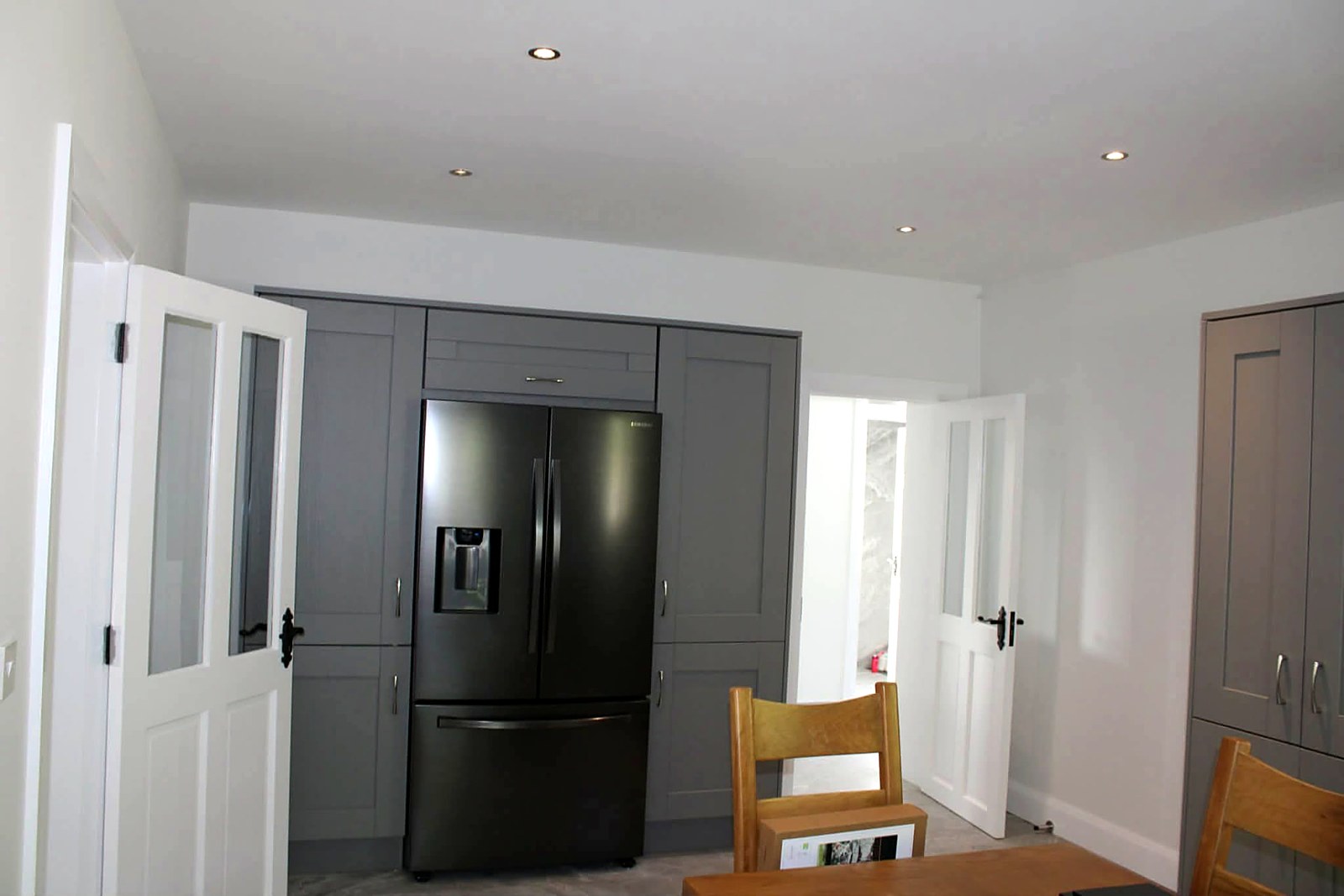 New-build kitchen with grey shaker units sprayed and finished
