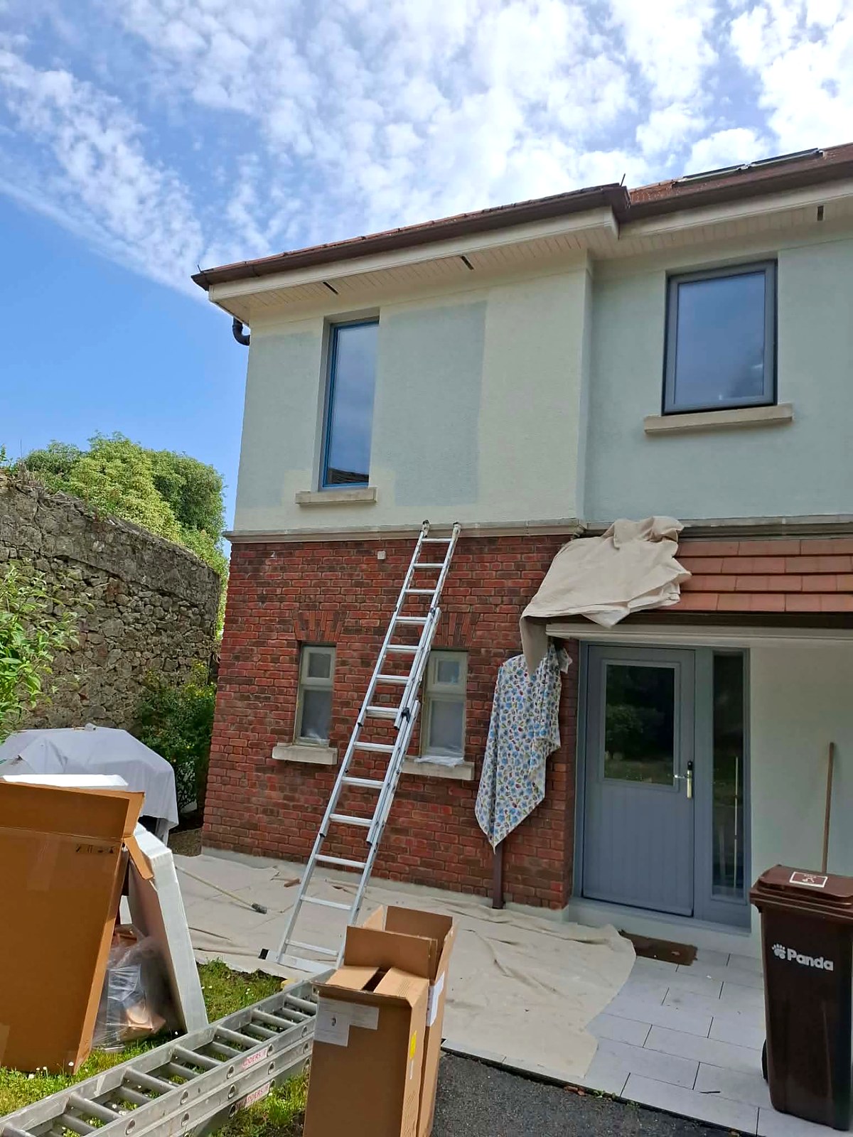 Rear elevation with ladder in place, painted render, doors and window frames