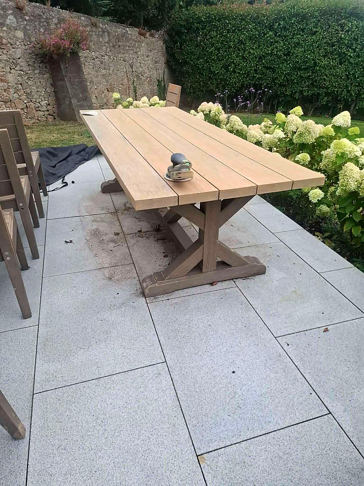 Weathered garden table sanded back to bare timber before painting