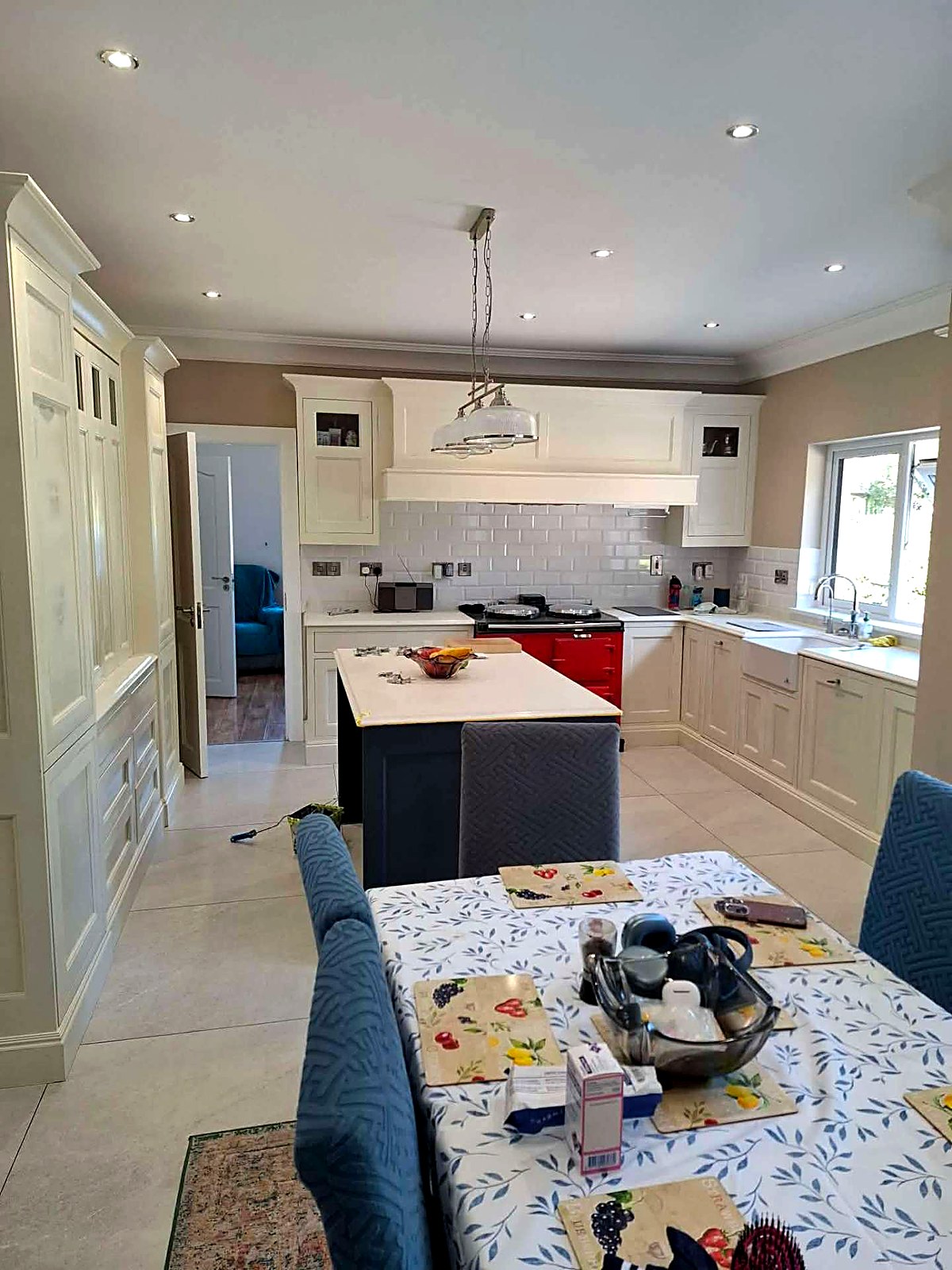 Hand-painted cream kitchen with navy island and white worktop