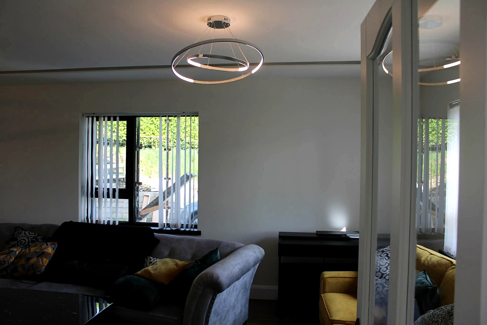Living room with feature lighting and freshly painted walls and ceiling