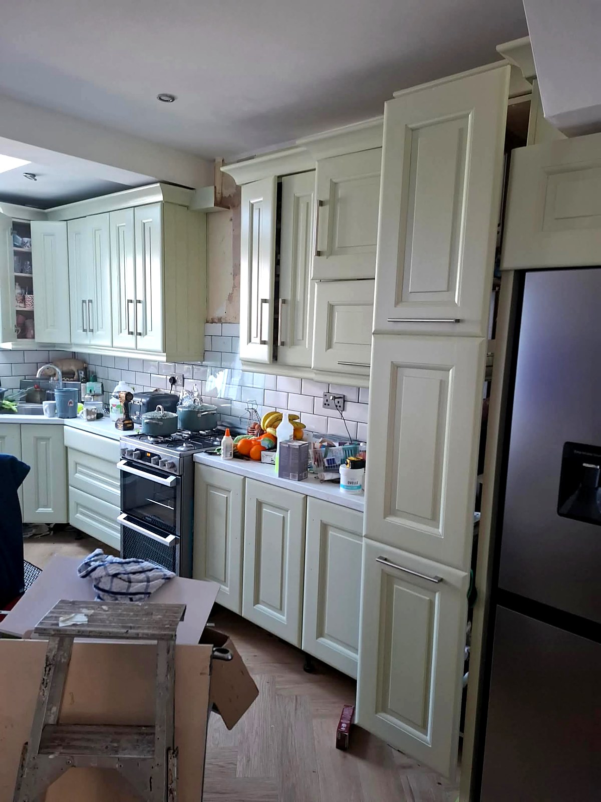 The same kitchen hand-painted in a warm cream finish
