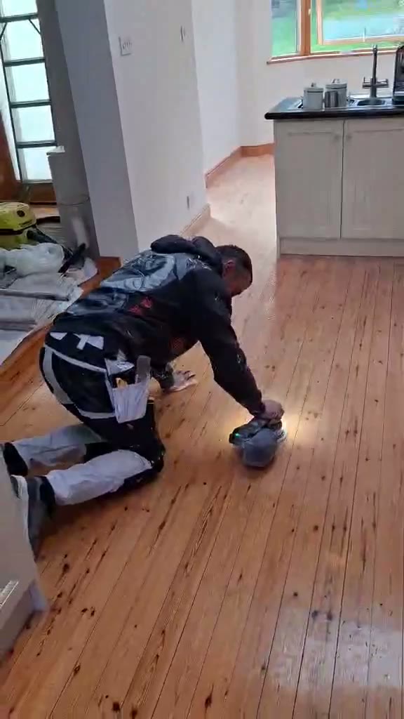 Video of sanding and refinishing a timber floor during a decorating job