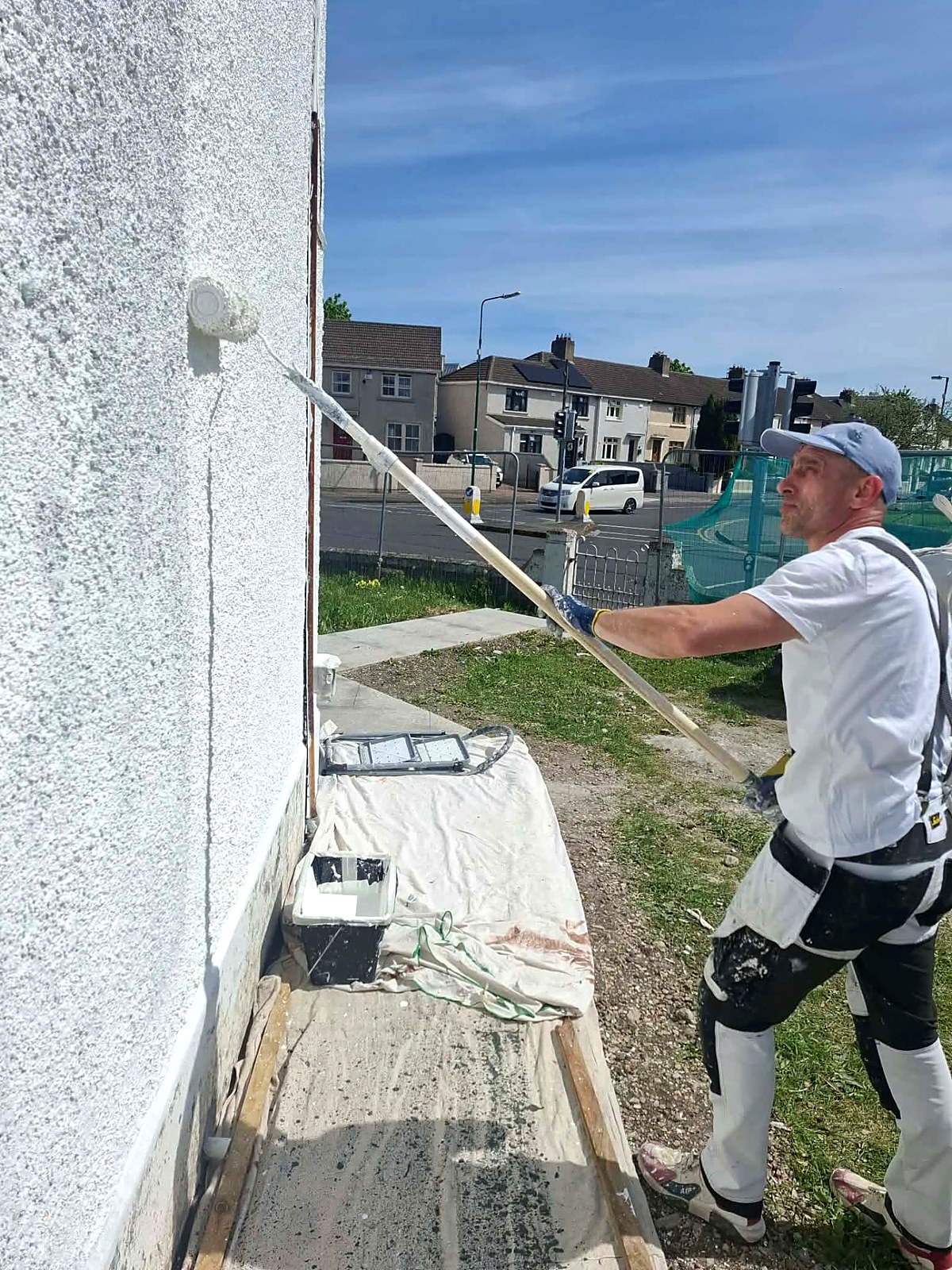 Close detail of a freshly rolled white masonry finish on an exterior render wall